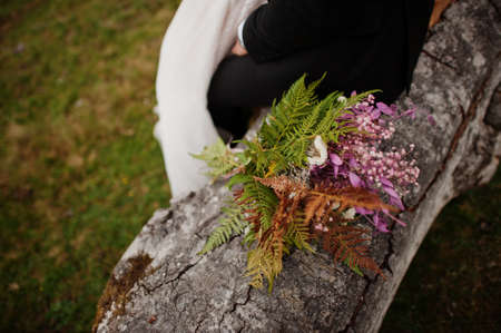 Beautiful tender wedding bouquet and rings.の写真素材