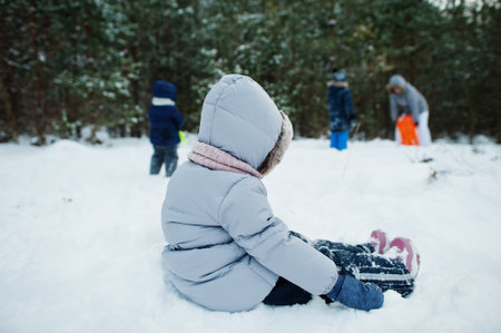 Children in winter nature. Outdoors in snow.