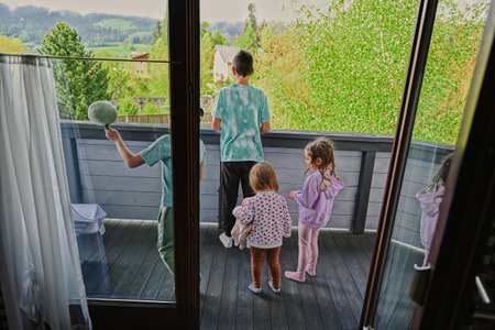Children at the balcony in mountain Austria.