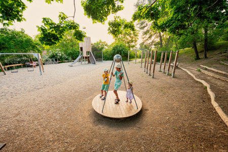 Three kids rides on the playground. Centrifuge, swing for children.の写真素材