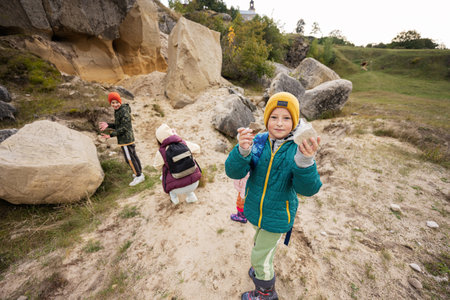 Boy explore limestone stones at mountain in Pidkamin, Ukraine.の写真素材
