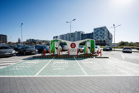Lviv, Ukraine - October 09, 2022: Electromobile charging station. Electric car accumulator recharging, green energy technology.,のeditorial素材