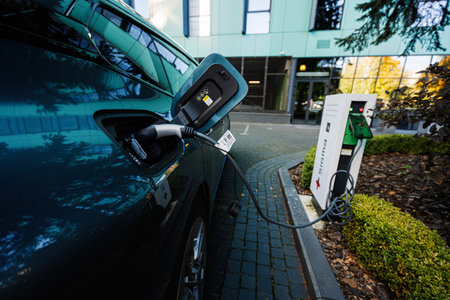 Lviv, Ukraine - October 09, 2022: BMW iX on charging station. Car is a battery electric mid size luxury crossover SUV.のeditorial素材