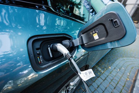 Lviv, Ukraine - October 09, 2022: BMW iX on charging station. Car is a battery electric mid size luxury crossover SUV.のeditorial素材