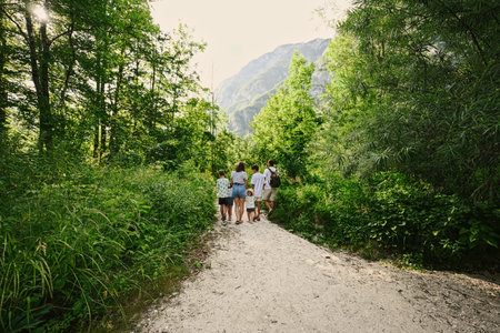 Back of family with four kids in Triglav National Park, Slovenia.の写真素材