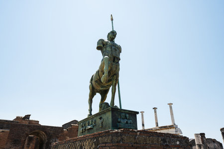 Statue of an ancient lancer on the forum of the ancient city of Pompeii, Italy.の写真素材