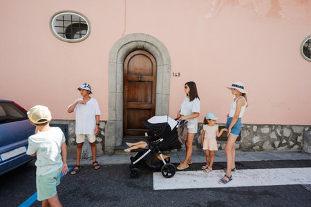 Family tourist walking at famous village Positano on vacation in Italy.の写真素材