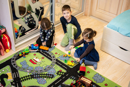 Child leisure activity, creative game. Kids play at home with toy train.の写真素材
