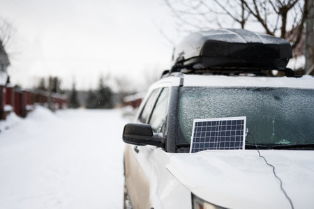 Portable solar panel on SUV car at winter.の写真素材