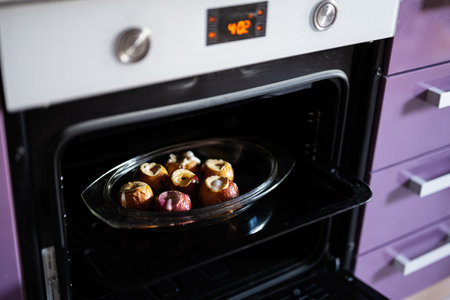 Homemade baked apples in the oven.の写真素材