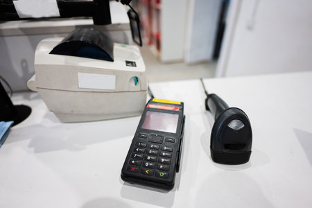 Payment pos terminal on a store counter.の写真素材