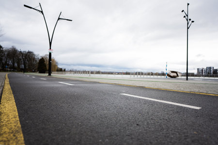 Running and cycling paths along the city alley embankment. Lake promenade.の写真素材