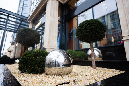 Shiny metallic mirror reflection balls,  urban decoration of modrern buildings.の写真素材