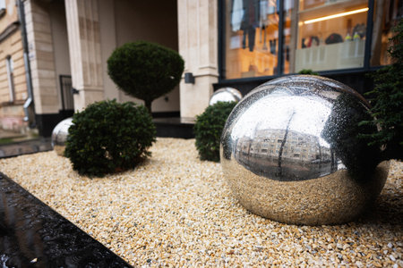 Shiny metallic mirror reflection balls,  urban decoration of modrern buildings.の写真素材