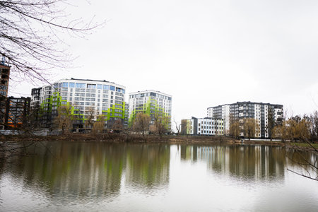 Modern residential multistory apartment buildings near lake. Facade of new houses.の写真素材