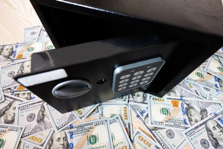 Code lock safe door against dollar money.の写真素材