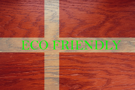 Denmark flag on wooden background for global eco friendly environment, ecological and environmental saving and go green country concept.の写真素材