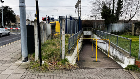 Public pathway approaching an underpass for pedestrians in Enfield, London, UK