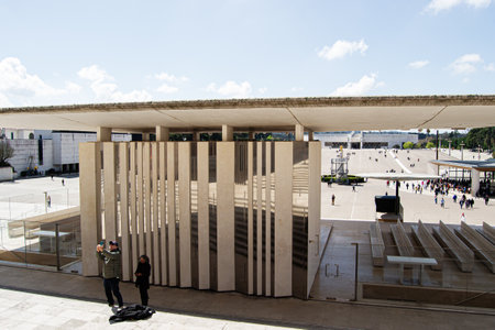 Fatima, Portugal - March 26, 2025: Contemporary architecture in Fatima, Portugal, featuring a public square with visitorsの写真素材
