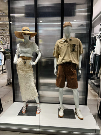 Fashion forward clothing display on mannequins featuring elegant summer and casual stylesの写真素材