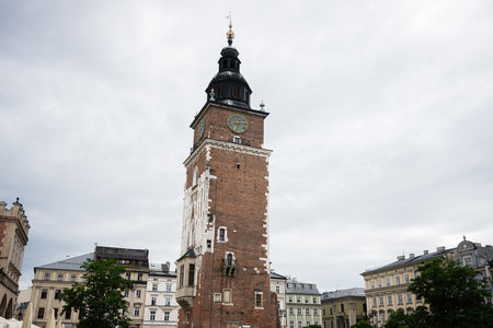 The town hall tower in Krakow, Poland, features beautiful and historic architecture.