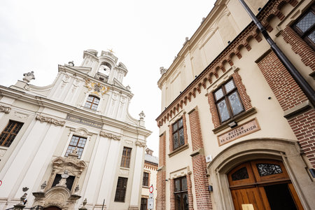 Elegant historical buildings in Krakow Poland showcasing architecture of Piarist Church and museumsの写真素材