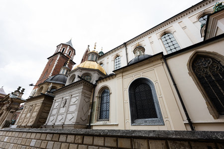 Ornate cathedral showcasing domes and steeple architecture in Krakow, Poland.の写真素材