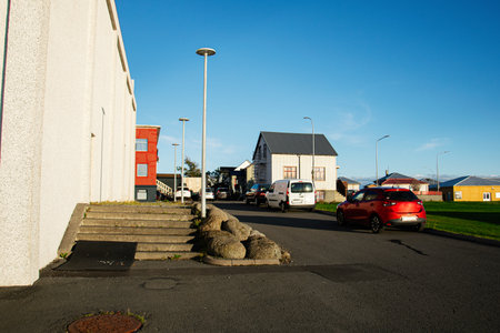 A street scene in Iceland featuring buildings, cars, and clear blue skies.の写真素材