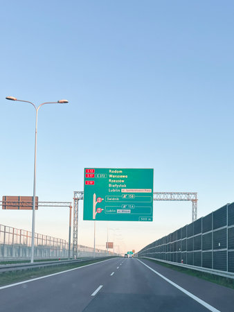 A road view with informative signs directing to major cities and bypass optionsの写真素材