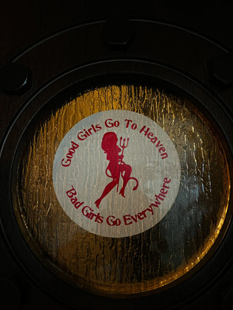Circular sticker with humour filled message inspired by a red silhouette illustration.の写真素材