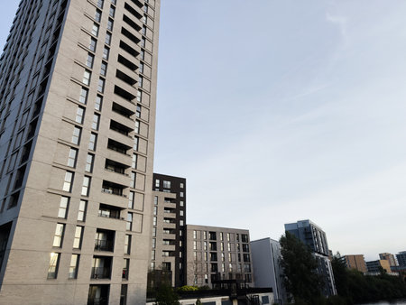 High-rise residential buildings in Salford with clear skies and urban surroundings