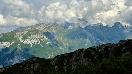 Majestic alpine landscape near Zakopane, rugged peaks, green valleys, dramatic clouds.