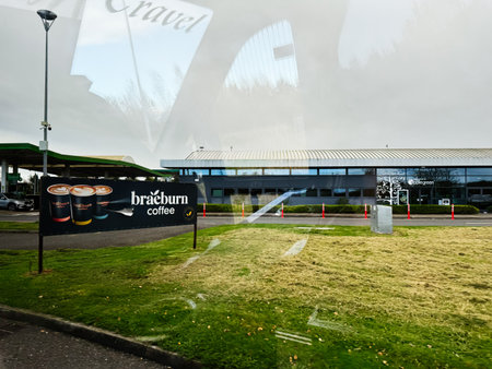 Dublin, Ireland - October 21, 2025: Exterior view of a coffee shop in Ireland featuring a Braeburn sign and reflective glass facade.のeditorial素材