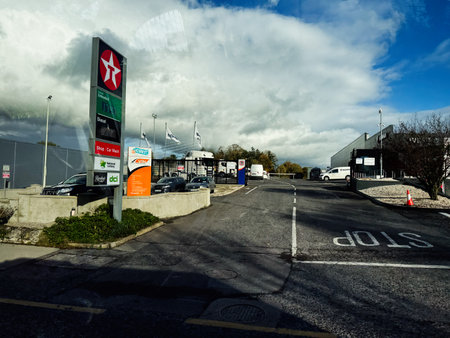Edgeworthstown, Ireland - October 21, 2025: Busy service area in Ireland with a tall gas station...