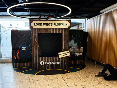 Dublin, Ireland - October 21, 2025: A playful Halloween display at Dublin Airport with spooky decor and a welcoming, themed setup for visitors.のeditorial素材