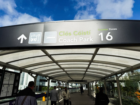 Dublin, Ireland - October 21, 2025: Covered walkway to a coach park sign in Dublin, Ireland, under a...