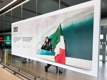 Dublin, Ireland - October 21, 2025: Vibrant wall banner at Dublin Airport depicting Katie Taylor with an Irish flag to mark a 2012 timeline exhibit.のeditorial素材