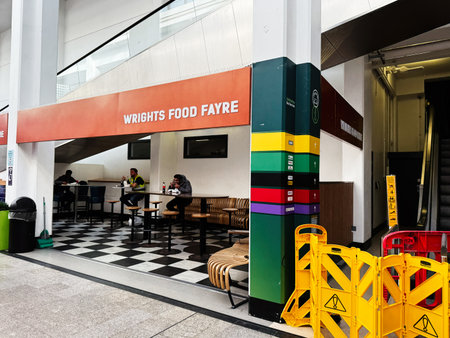 Dublin, Ireland - October 21, 2025: Dublin Ireland cafe seating with checkered floor, colorful pillar, and casual dining atmosphere.のeditorial素材