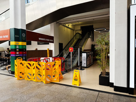 Dublin, Ireland - October 21, 2025: Busy mall scene in Dublin featuring yellow safety barriers, an...