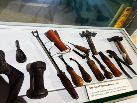 Knock, Ireland - October 22, 2025: Vintage harness makers tools on display in Knock Ireland, featuring leatherwork chisels hammers and kicks of hardware.のeditorial素材