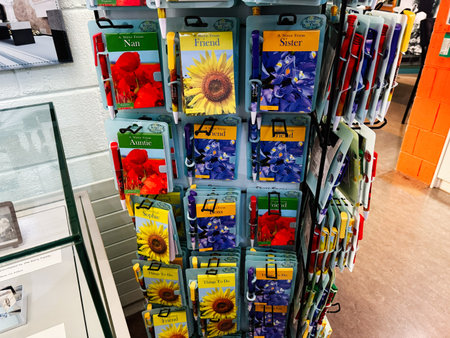 Knock, Ireland - October 22, 2025: Colorful display of floral greeting cards and pens on a rack in a store in Knock Ireland.のeditorial素材