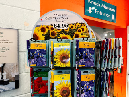 Knock, Ireland - October 22, 2025: Bright sunflower cards for Mum Nan and Grandma displayed in a colorful shop rack at Knock Ireland museum.のeditorial素材
