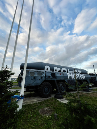 Krakow, Poland - October 25, 2025: Weathered military Proton rocket launcher on public display under a partly cloudy blue sky, suggesting scale and industrial design in Balice, Krakow, Poland.のeditorial素材