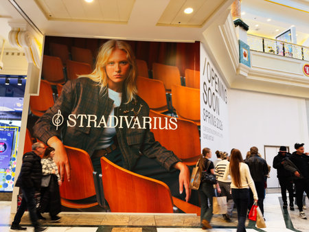 Stretford, UK - November 15, 2025: Large fashion banner promotes opening soon in a Manchester mall with shoppers passing by.のeditorial素材