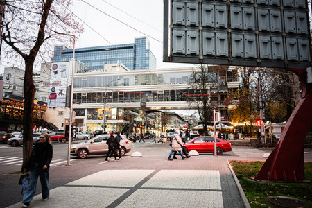 Chisinau, Moldova - November 22, 2025: Urban scene in Chisinau Moldova with pedestrians, cars, shops...