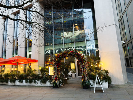 Manchester, UK - December 10, 2025: Festive arch welcomes guests at a modern Manchester Fumo by San...