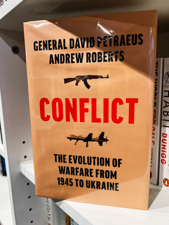 London, UK - December 12, 2025: Book cover about modern warfare evolution from 1945 to Ukraine, featuring weapon imagery.のeditorial素材