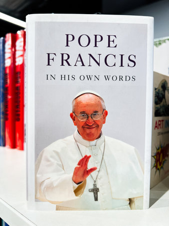 London, UK - December 12, 2025: A smiling Pope Francis on the cover of his book, displayed in a...