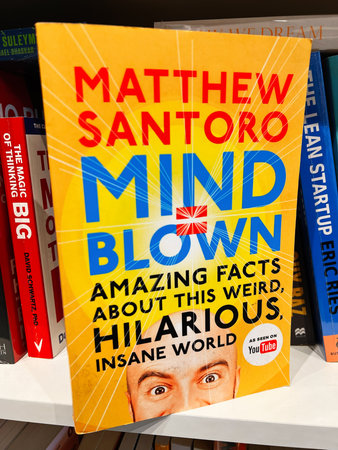 London, UK - December 12, 2025: Bright yellow book cover titled Mind Blown by Matthew Santoro, with...