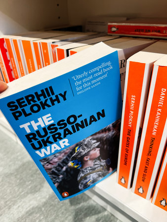 London, UK - December 12, 2025: Blue cover with bold black title on a bright bookstore shelf, featuring a soldier image. The Russo Ukrainian War by Serhii Plokhyのeditorial素材